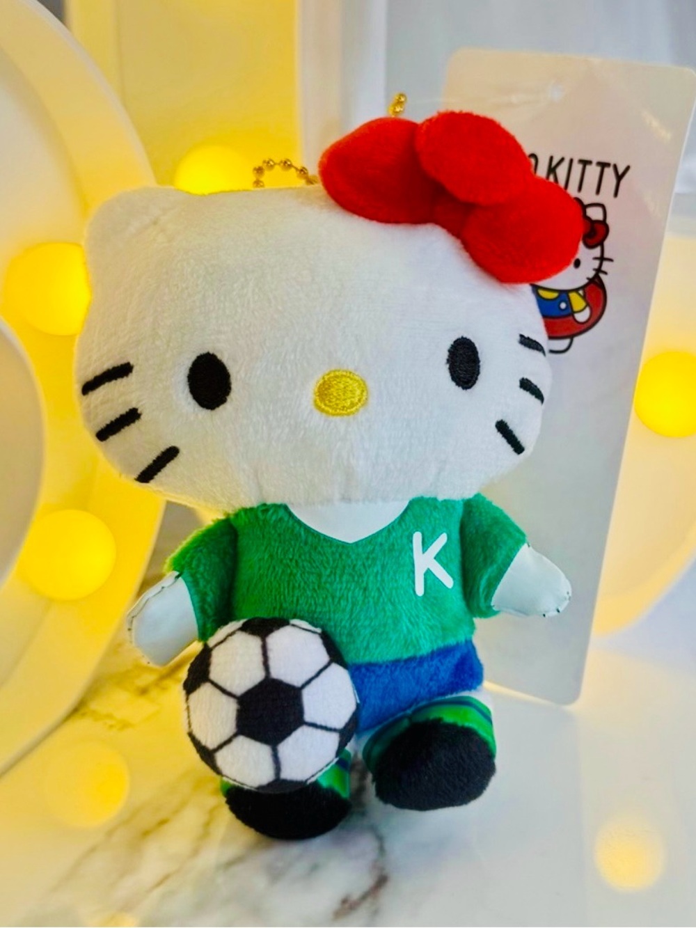 Sanrio Hello Kitty Plush in White, Red Bow & Green Jersey with Soccer Ball